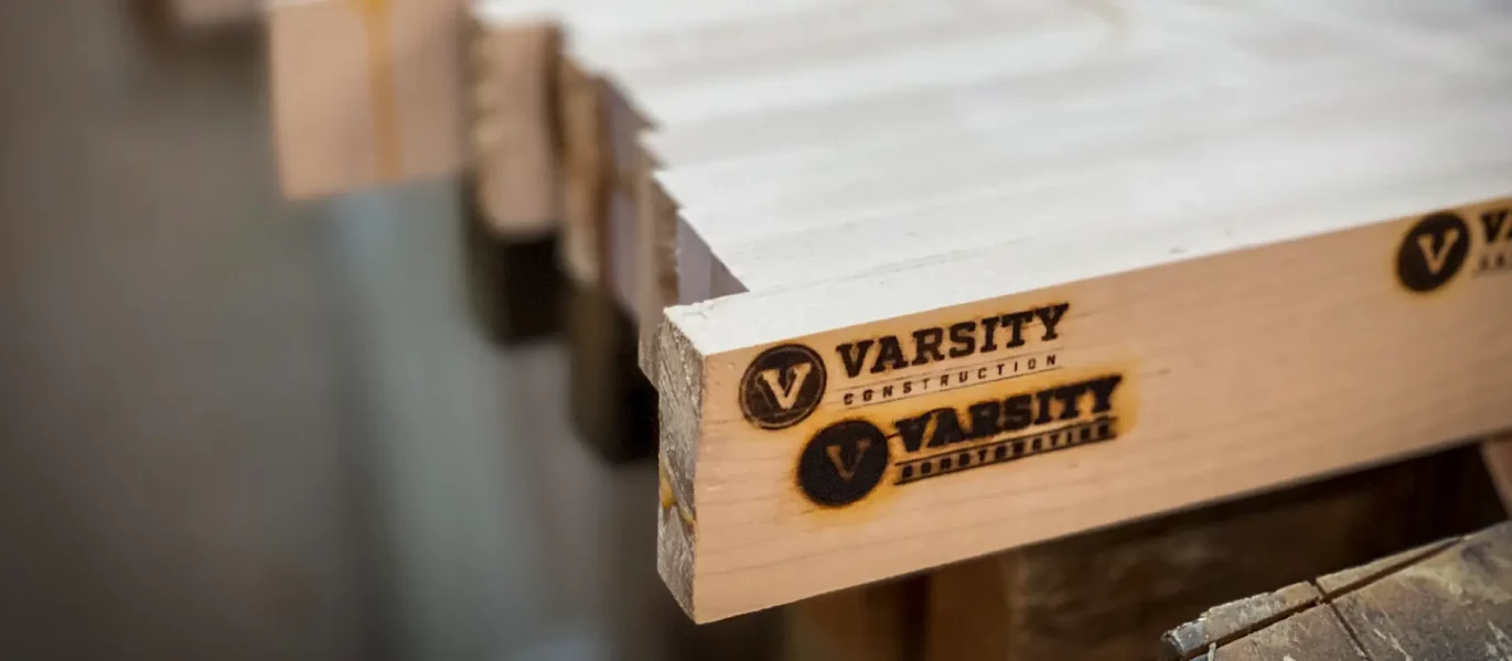 varsity-construction-woodshop-shuffleboard-branding-iron-logo