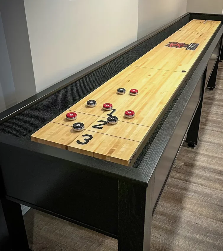 varsity-construction-fit-muscle-joint-clinic-shuffleboard-pucks-deuce-line