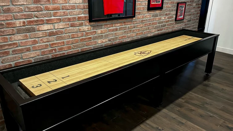 varsity-construction-shuffleboard-basement-sports-room-red-brick